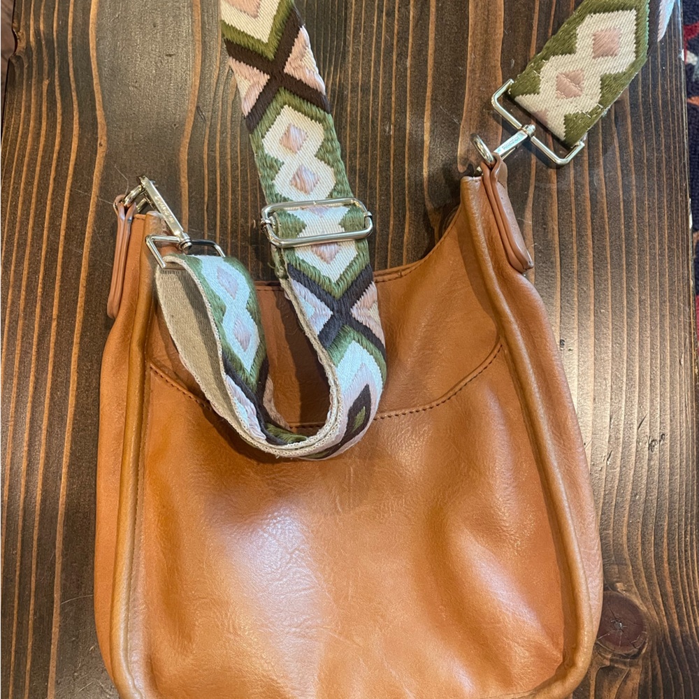 Ah-dorned vegan leather bag